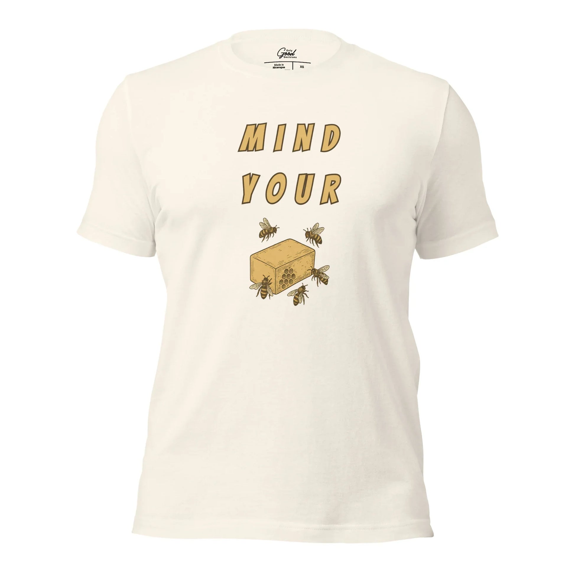 Vintage White Mind Your Bee's Wax visual pun graphic tee featuring the text "MIND YOUR" above an illustration of bees and a block of wax.