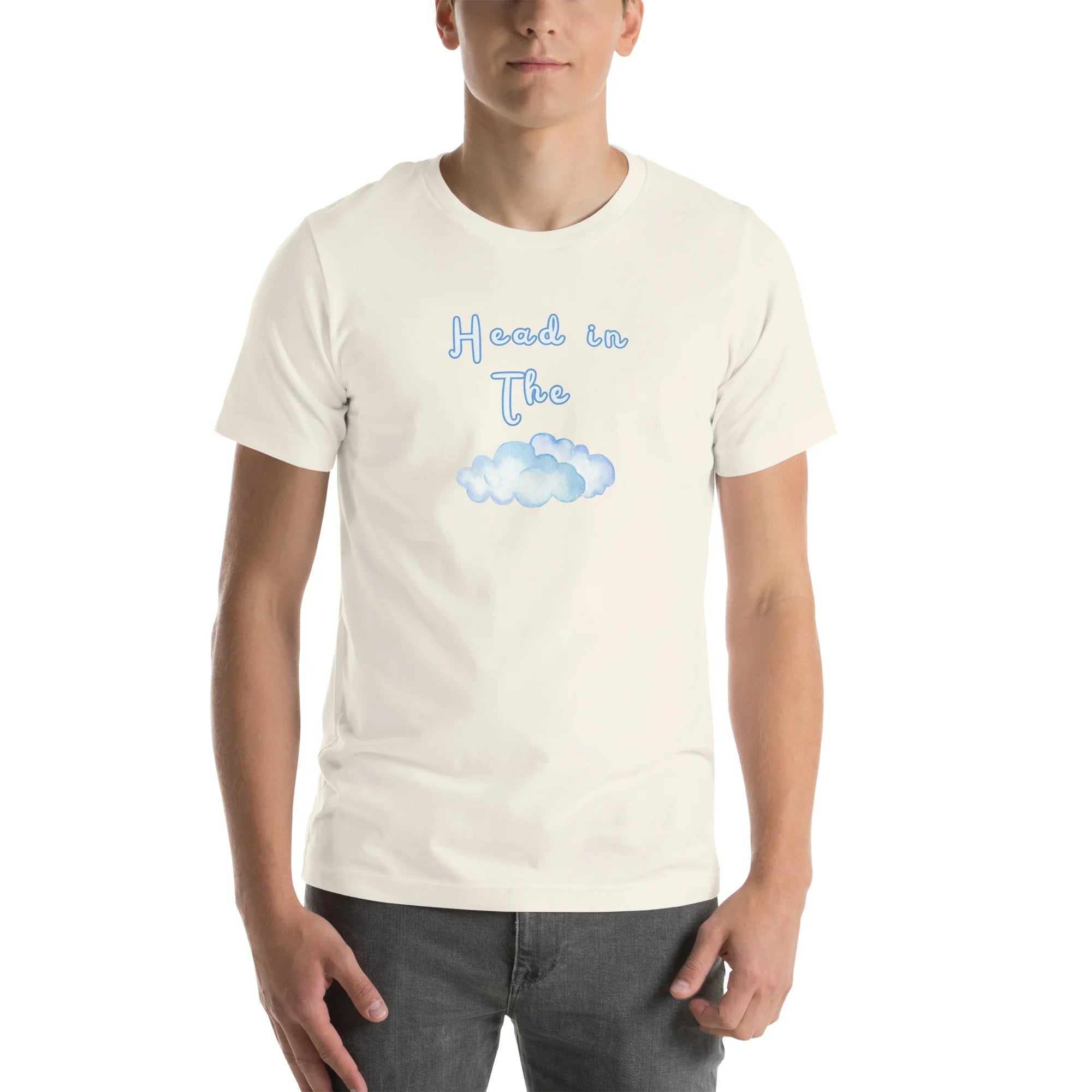 Vintage White Head In The Clouds visual pun graphic tee featuring "Head in The" text positioned above a blue watercolor cloud illustration.